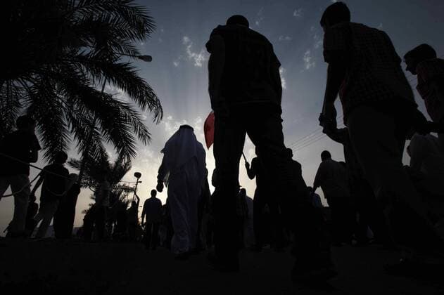 MANAMA, April 4, 2014 - Protesters take part in a march against Formula One Bahrain Grand Prix in Budaiya Highway near the capital of Manama, Bahrain, Friday, April 4, 2014. (Xinhua Hasan Jamali) BAHRAIN-F1-PROTEST 