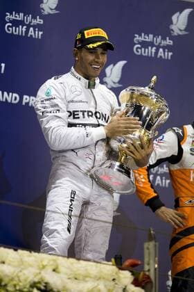 Sakhir, Kingdom of Bahrain - LEWIS HAMILTON of Great Britain and Mercedes AMG Petronas F1 Team is seen on the podium after claiming first place in the Formula 1 Bahrain Grand Prix 2014 at Bahrain International Circuit in Sakhir, Kingdom of Bahrain. F1 2014 - Bahrain Grand Prix - Hamilton Wins  - ZUMAg14