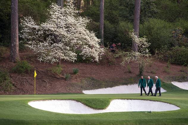 Golf legends Gary Player, Jack Nicklaus and Arnold Palmer walk together on the 12th green during a practice round prior to the Masters golf tournament at Augusta National Golf Club in Augusta, George, April 8, 2014.  AUG20140408349