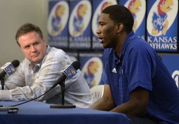 April 9, 2014 - Kansas City, MO, USA - Kansas Jayhawks freshman Joel Embiid, with coach Bill Self in the background, announced his intention to enter the NBA Basketbaul Herren USA draft during a press conference on Wednesday, April 9, 2014, in Lawrence, Kansas. Embiid Presser - ZUMAm67