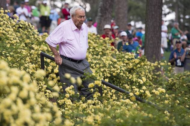 Arnold Palmer walks to the eighth green during the Par 3 Contest during the Masters Tournament at Augusta National Golf Club in Augusta, Georgia, April 8, 2014.  AUG20140409334