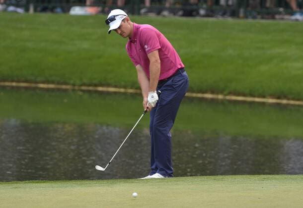 Justin Rose chips onto the ninth green during the Par 3 Contest during the Masters Tournament at Augusta National Golf Club in Augusta, Georgia, April 8, 2014.  AUG20140409351