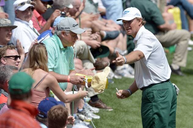 Earnie Els greets patrons during the Par 3 Contest during the Masters Tournament at Augusta National Golf Club in Augusta, Georgia, April 8, 2014.  AUG20140409352