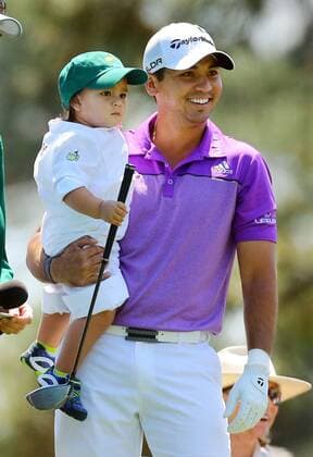 April 9, 2014 - Augusta, GA, USA - Jason Day holds his 21-month old son Dash while he waits to tee off on the No. 1 hole during the Par 3 Contest at Augusta National Golf Club in Augusta, Ga., on Wednesday, April 9, 2014. Masters Tournament - ZUMAm67