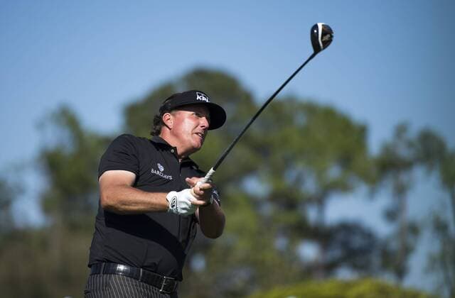 Phil Mickelson watches his drive off of the 10th tee during the first round of the 2014 Masters Tournament at Augusta National Golf Club in Augusta, Georgia, April 10, 2014.  AUG20140410349