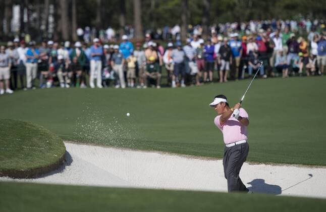 K.J. Choi hits from a bunker on the second hole during the first round of the 2014 Masters Tournament at Augusta National Golf Club in Augusta, Georgia, April 10, 2014.  AUG20140410372