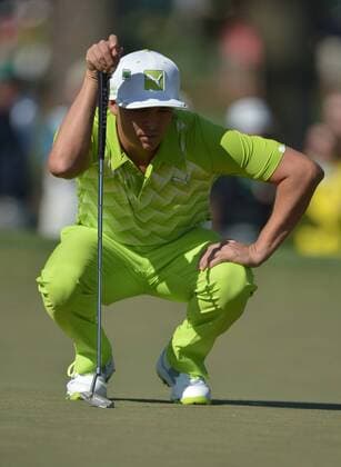 Rickie Fowler lines up a putt on the second green during the first round of the 2014 Masters Tournament at Augusta National Golf Club in Augusta, Georgia, April 10, 2014.  AUG20140410376