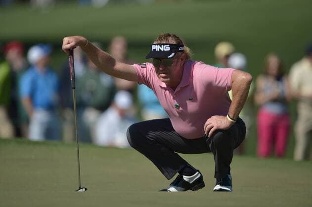 Miguel Angel Jimenez lines up a putt on the second green during the first round of the 2014 Masters Tournament at Augusta National Golf Club in Augusta, Georgia, April 10, 2014.  AUG20140410377