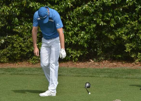 Justin Rose reacts after hitting off of the 5th tee during the second round of the 2014 Masters Tournament at Augusta National Golf Club in Augusta, Georgia, April 11, 2014. Watson finished seven under par.  AUG20140411332