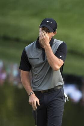 Rory McIlroy reacts after putting on the 16th green during the second round of the 2014 Masters Tournament at Augusta National Golf Club in Augusta, Georgia, April 11, 2014. Watson finished seven under par.  AUG20140411346