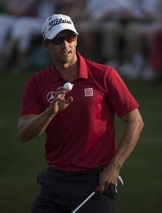 Adam Scott acknowledges the patrons after putting on the 16th green during the second round of the 2014 Masters Tournament at Augusta National Golf Club in Augusta, Georgia, April 11, 2014. Watson finished seven under par.  AUG20140411350