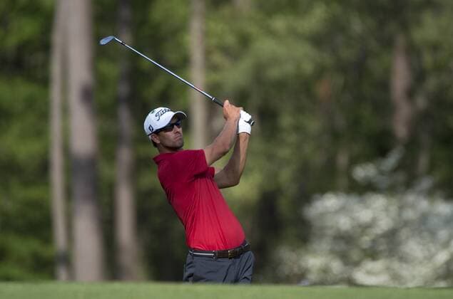 Adam Scott watches his drive off of the 12th tee during the second round of the 2014 Masters Tournament at Augusta National Golf Club in Augusta, Georgia, April 11, 2014. Watson finished seven under par.  AUG20140411361