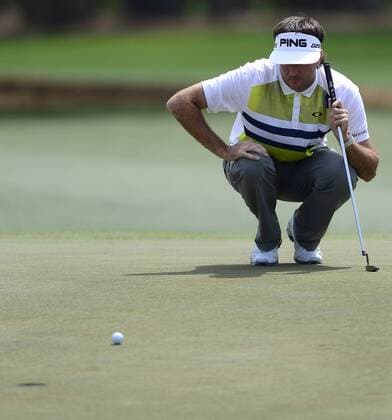 April 11, 2014 - Augusta, GA, USA - Bubba Watson lines up his putt on the 18th green in the second round at the Masters Tournament in August, Ga., on Friday, April 11, 2014. Masters Tournament - ZUMAm67