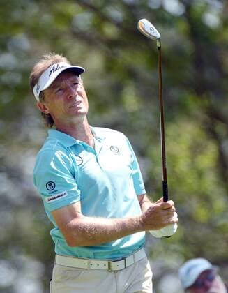 Bernhard Langer watches his tee shot on the 4th hole in the third round of the 2014 Masters Tournament at Augusta National Golf Club in Augusta, Georgia on April 12, 2014.  AUG20140412308