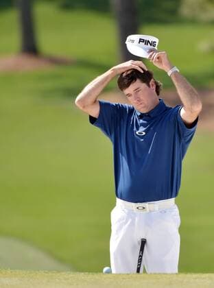 Bubba Watson waits to putt on the 7th green in the third round of the 2014 Masters Tournament at Augusta National Golf Club in Augusta, Georgia on April 12, 2014.  AUG20140412347