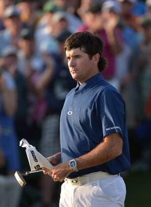 Bubba Watson walks off the 18th green after finishing his third round at the 2014 Masters Tournament at Augusta National Golf Club in Augusta, Georgia, April 12, 2014. Watson finished seven under par.  AUG20140412416