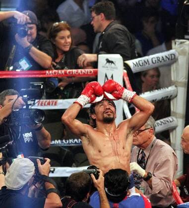 MANNY PACQUIAO celebrates his victory over TIMOTHY BRADLEY in their WBO World Welterweight Championshipp rematch Saturday April 12, 2014 in Las Vegas, NV. He won by a judges decisiion. Pacquiao Wins In Las Vegas - ZUMAb91