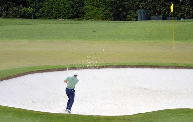 Jordan Spieth holes out from a bunker for a birdie on the 4th hole in the final round round of the 2014 Masters Tournament at Augusta National Golf Club in Augusta, Georgia on April 13, 2014.  AUG20140413303