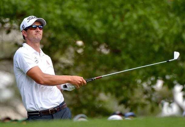 Adam Scott watches his tee shot on the 4th hole in the final round round of the 2014 Masters Tournament at Augusta National Golf Club in Augusta, Georgia on April 13, 2014.  AUG20140413311