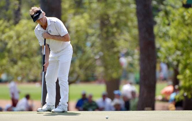 Bernhard Langer putts on the 3rd hole in the final round round of the 2014 Masters Tournament at Augusta National Golf Club in Augusta, Georgia on April 13, 2014.  AUG20140413306