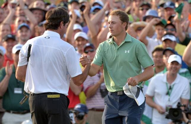 Bubba Watson shakes hands with Jordan Spieth on the 18th green after the final round round of the 2014 Masters Tournament at Augusta National Golf Club in Augusta, Georgia on April 13, 2014. Watson wins the Masters with a score of 8 under par.  AUG20140413355