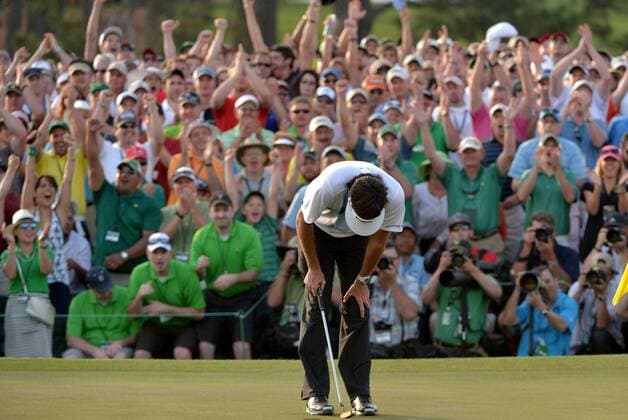 Bubba Watson reacts on the 18th green after the final round round of the 2014 Masters Tournament at Augusta National Golf Club in Augusta, Georgia on April 13, 2014. Watson wins the Masters with a score of 8 under par.  AUG20140413356