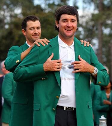 April 13, 2014 - Augusta, GA, USA - Bubba Watson becomes a two-time Masters champion as Adam Scott presents him his second green jacket after winning The Masters at Augusta National Golf Club in Augusta, Ga., Sunday, April 13, 2014. The Masters 2014 - ZUMAm67