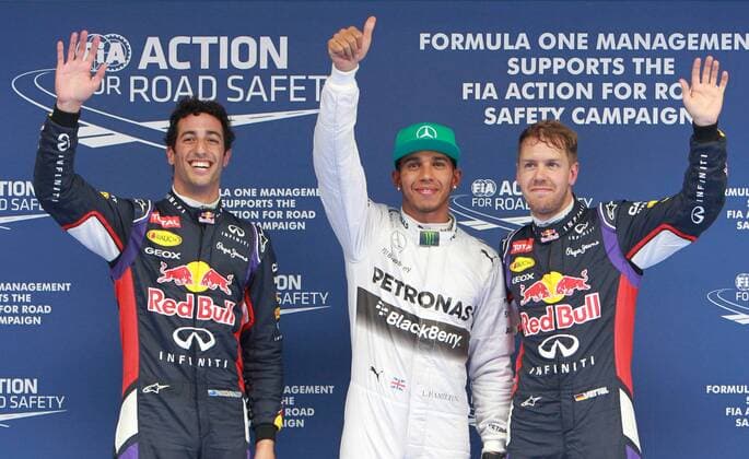 Mercedes AMG Petronas British driver Lewis Hamilton (C), Red Bull Australian driver Daniel Ricciardo (L) and his teammate Spanish driver Sebastian Vettel greet spectators after the qualifying session at the Formula One Chinese Grand Prix in Shanghai on April 19, 2014. (Xinhua Fan Jun) (SP)CHINA-SHANGHAI-F1 