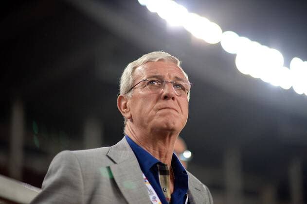 (140422) -- GUANGZHOU, April 22, 2014 (Xinhua) -- Marcello Lippi, coach of Guangzhou Evergrade, looks on before a Group G match against Yokohama F.Marinos at AFC Champions League in Guangzhou, China on April 22, 2014. (Xinhua Liu Dawei) (SP)CHINA-GUANGZHOU-SOCCER-AFC CHAMPIONS LEAGUE 