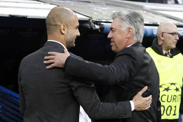 Real Madrid s Carlo Ancelotti and FC Bayern München s Pep Guardiola during Champions League soccer match Real Madrid v FC Bayern München at Santiago Bernabeu stadium in Madrid, Spain. April 23, 2014.  (20140423194)