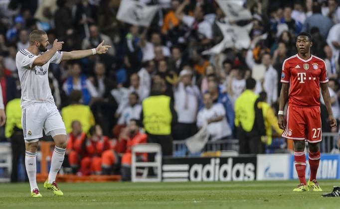 Semifinals first leg of Champions League match between Real Madrid and Bayern Munich. In this picture, Karim Benzema celebrates after scoring the first goal for Real Madrid and shoots on David Alaba. xDIEGOxGxSOUTOx 