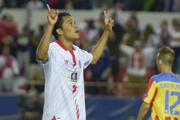 SEVILLE, SPAIN, April 24, 2014: Carlos Bacca scoring the second goal of Sevilla. during the match Sevilla FC - Valencia FC Semifinal leg of the Champions League held at the Sanchez Pizjuan stadium in Seville, Spain. (Photo: Carlos Bouza Cordon Press)  13300