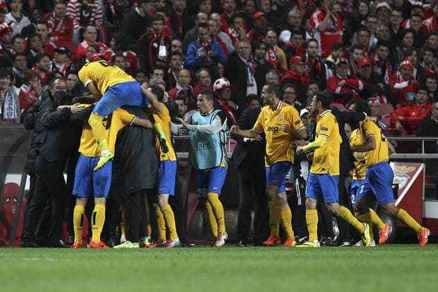Juventus Argentine forward Carlos Tevez celebrates with his teammates after scoring a goal during a soccer match between SL Benfica from Portugal and Juventus FC from Italy for the first hand of the Semi-Final of the UEFA Europa League, in Benfica s Luz Stadium in Lisbon, Portugal, on April 24, 2014. Photo by Pedro Nunes Portugal: UEFA Europa League 