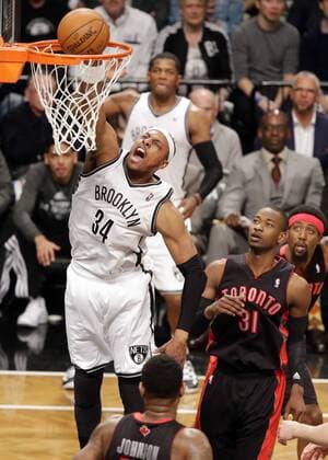 Brooklyn Nets Paul Pierce dunks the basketball in the second quarter against the Toronto Raptors in Game 3 of the Eastern Conference Quarterfinals at Barclays Center in New York City on April 25, 2014.  NYP20140425102