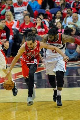 Chicago Bulls center Joakim Noah (13) strips Washington Wizards forward Nene Hilario (42) of the ball in the third game of the first round of playoffs at the Verizon Center in Washington, D.C. on April 25, 2014 where the Chicago Bulls defeated the Washington Wizards 100-97.  WAG2014042519