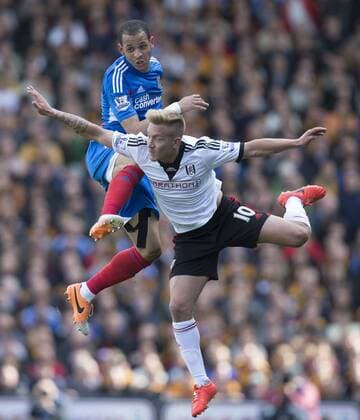 26.04.2014. London, England. Liam Rosenior of Hull City and Lewis Holtby of Fulham during the Barclays Premier League match between Fulham and Hull City at Craven Cottage. xNigelxCookex  ActionPlus20415577