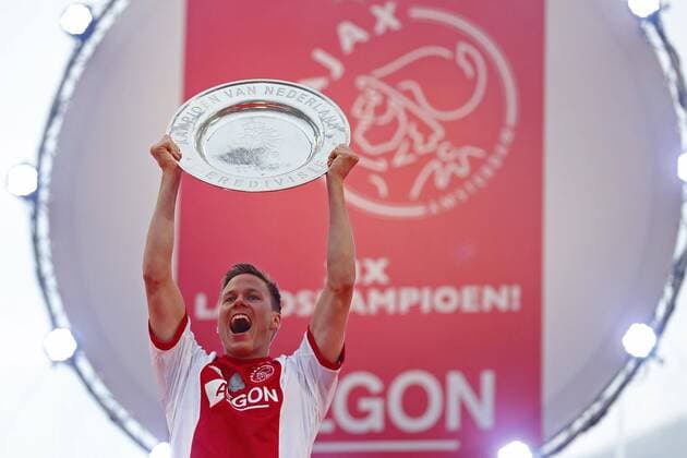 Niklas Moisander of Ajax celebrates with the Eredivisie Championship trophy celebrate winning the Dutch Eredivisie title at the Amsterdam Arena 2014 in Amsterdam, The Netherlands. Ajax crowned Eredivisie champions Dutch Eredividie 2013 2014 xVIxLaurensxLindhoutxIVx 2269070