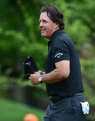 April 30, 2014 - Charlotte, NC, USA - Phil Mickelson smiles at the gallery as he walks off the second green during the Wells Fargo Championship Pro-Am at Quail Hollow Club in Charlotte, N.C., Wednesday, April 30, 2014. Wells Fargo Championship Pro-Am - ZUMAm67