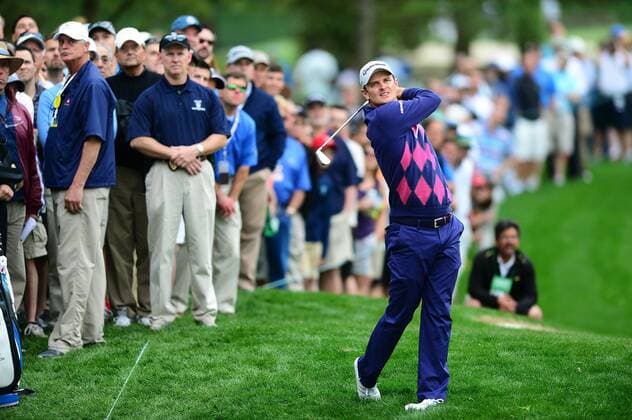 May 2, 2014 - Charlotte, NC, USA - Justin Rose hits his drive along the 18th fairway as a large gallery watches during the second day of competition at the Wells Fargo Championship at the Quail Hollow Club in Charlotte, N.C., Friday, May 2, 2014. Wells Fargo Championship - ZUMAm67