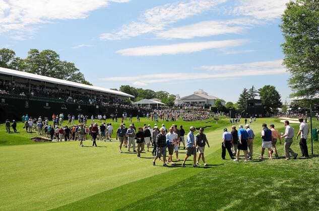 May 2, 2014 - Charlotte, NC, USA - Spectators cross the 18th fairway during the second day of competition in the Wells Fargo Championship at Quail Hollow Club in Charlotte, N.C., Friday, May 2, 2014. Wells Fargo Championship - ZUMAm67