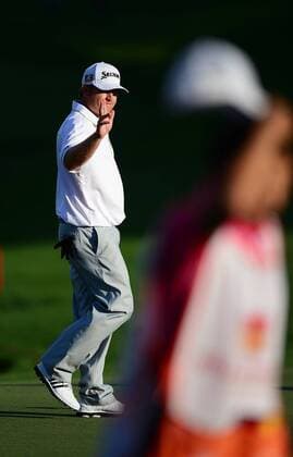 May 2, 2014 - Charlotte, NC, USA - J.B. Holmes waves to the crowd after sinking a birdie putt on the 19th hole to go to -7 after the second round of the Wells Fargo Championship at Quail Hollow Club in Charlotte, N.C., Friday, May 2, 2014. Wells Fargo Championship - ZUMAm67