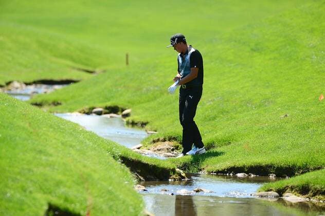May 3, 2014 - Charlotte, NC, USA - Rickie Fowler on the 18th hole after his ball landed in the creek during the third round of the Wells Fargo Championship at Quail Hollow Club in Charlotte, N.C., on Saturday, May 3, 2014. Wells Fargo Championship, Round 3 - ZUMAm67