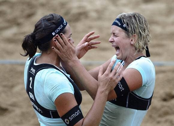 Germany s Laura Ludwig (R) and Kira Walkenhorst celebrate victory over China during the women s final at 2014 FIVB Beach Volleyball World Tour Shanghai PPTV Grand Slam in Shanghai, east China, May 4, 2014. Germany won 2-1. (Xinhua Jiang Kehong) (SP)CHINA-SHANGHAI-BEACH VOLLEYBALL-SHANGHAI GRAND SLAM-WOMEN(CN) 