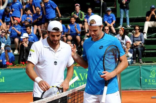 Handshake between German Julian Reister (R) (worldwide 129th) and Italian Simone Bolleli (L) (worldwide 224th) during the Final of the open Tunis. Italian tennis player Simone Bolleli (224th World) won the Tunis Open, ATP Tennis Herren tournament on clay with the 125,000 dollars in the final played on Sunday at the Tennis Club of Tunis. Tunis Open - Italian Simone Bolleli wins the trophy Tunis Open 2014 - Italian Simone Bolleli wins the trophy. 