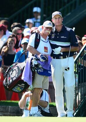 May 4, 2014 - Charlotte, NC, USA - Jim Furyk wraps his arm around his caddy Fluff after finishing his round of the Wells Fargo Championship at Quail Hollow Club in Charlotte, N.C., on Sunday, May 4, 2014. Wells Fargo Championship - ZUMAm67