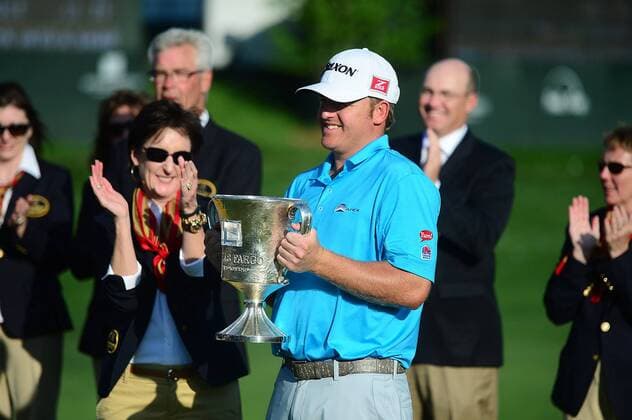 May 4, 2014 - Charlotte, NC, USA - J.B. Holmes is presented with the Wells Fargo championship trophy at Quail Hollow Club in Charlotte, N.C., on Sunday, May 4, 2014. Wells Fargo Championship - ZUMAm67