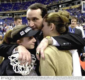 April 2, 2001 - U.S. - KRT SPORTS STORY SLUGGED: FINALFOUR KRT PHOTOGRAPH BY PATRICK SCHNEIDER CHARLOTTE OBSERVER (April 2) MINNEAPOLIS, MINNESOTA - Duke coach Mike Krzyzewski celebrates with daughters Jamie, left, and Linday, after the Blue Devils 82-72 victory over the Arizona Wildcats to win the NCAA College League USA National Championship at the Metrodome, Monday night. (CH) PL KD BL 2001 (Horiz) (Digital image) (smd) News Archive - April 2, 2001 - ZUMAm67