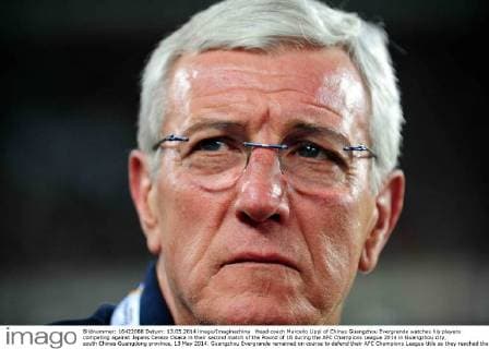 Head coach Marcello Lippi of Chinas Guangzhou Evergrande watches his players competing against Japans Cerezo Osaka in their second match of the Round of 16 during the AFC Champions League 2014 in Guangzhou city, south Chinas Guangdong province, 13 May 2014. Guangzhou Evergrande remained on course to defend their AFC Champions League title as they reached the quarter-finals with a 5-2 aggregate win over Cerezo Osaka on Tuesday (13 May 2014). The Chinese champions backed by Marcello Lippi lost 1-0 on the night, courtesy of a Liao Lisheng own goal, but Cerezo never looked likely to bridge the 5-1 deficit conceded in the first leg last week. Guangzhou Evergrande lose to Cerezo Osaka but cruise into last eight at AFC Champions League  20140513_34322