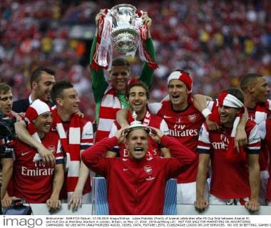 Lukas Podolski (Front) of Arsenal celebrates after FA Cup final between Arsenal FC and Hull City at Wembley Stadium in London, Britain, on May 17, 2014. (Xinhua Wang Lili) NOT FOR SALE FOR MARKETING OR ADVERTISING CAMPAIGNS. NO USE WITH UNAUTHORIZED AUDIO, VIDEO, DATA, FIXTURE LISTS, CLUBLEAGUE LOGOS OR LIVE SERVICES. NO USE IN BETTING, GAMES OR SINGLE CLUBLEAGUEPLAYER PUBLICATIONS. (SP)BRITAIN-LONDON-SOCCER-FA CUP-FINAL-ARSENAL VS HULL CITY 