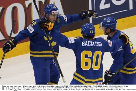 ITAR-TASS: MINSK, BELARUS. MAY 18, 2014. Sweden s Joakim Lindstrom, Mikael Backlund and Oscar Moller (L-R) seen in the 2014 IIHF World Championship Preliminary Round Group A ice hockey match against Canada at Chizhovka Arena Stadium. The Canadian team won the game 3:2.  premiumd RE144379